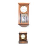 An oak cased wall clock and mantel clock