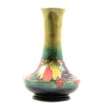 Moorcroft Pottery, a 'Leaf and Berry' design vase