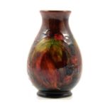 Moorcroft Pottery, a flambe 'Leaf and Berry' design vase