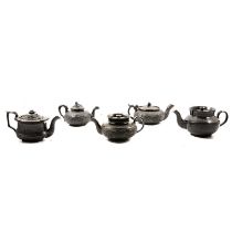 Five black basalt teapots, including one by Cyples