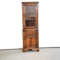 Oak corner cabinet and a nest of tables by Titchmarsh & Goodwin,