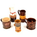 Collection of studio pottery mugs and other vessels.