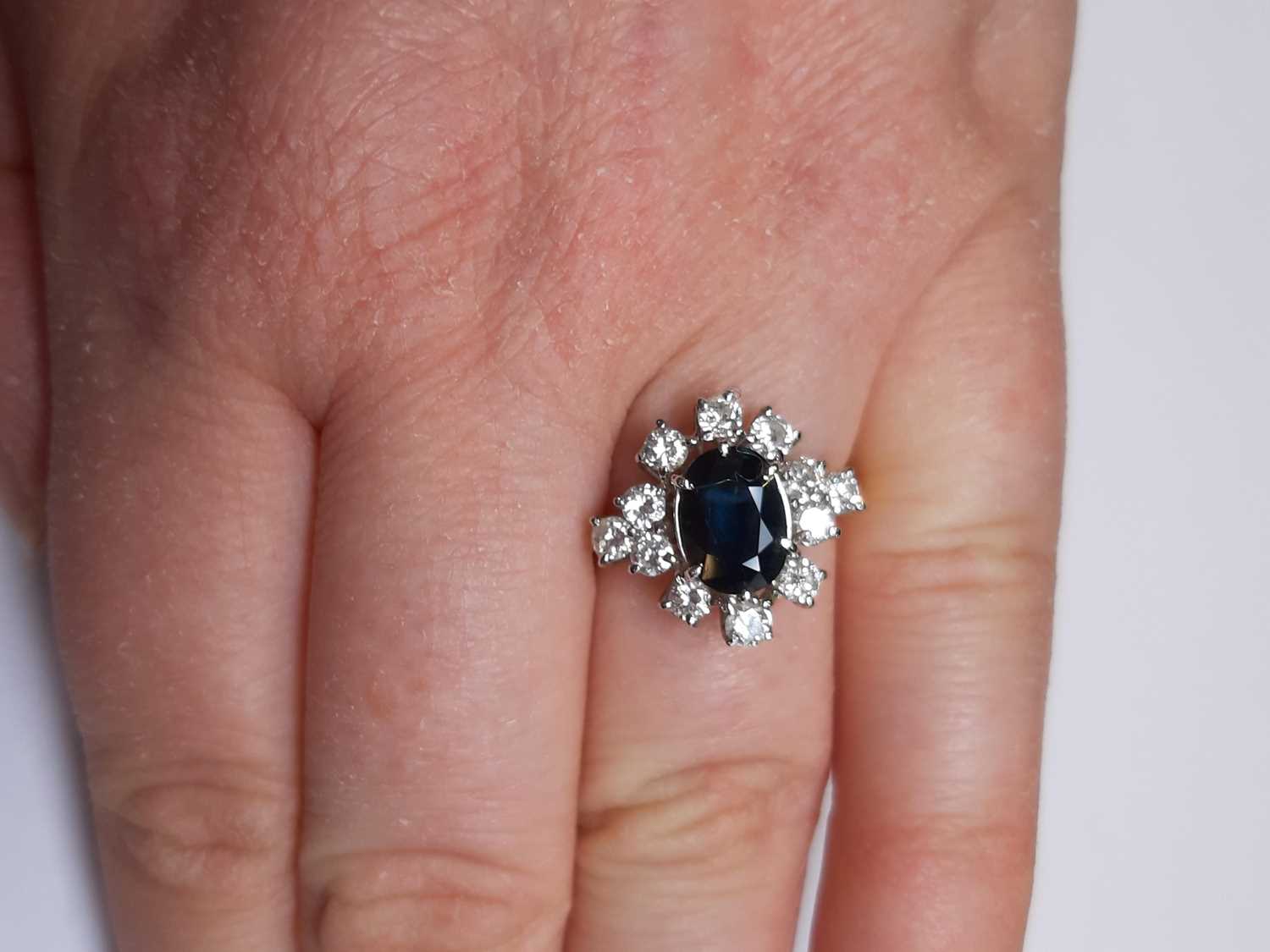 A sapphire and diamond cluster ring. - Image 4 of 7
