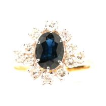 A sapphire and diamond cluster ring.