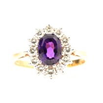 An amethyst and diamond cluster ring.