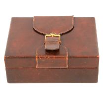 A Rolex brown leather watch box with buckle.