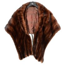 A fur cape and a fur stole.