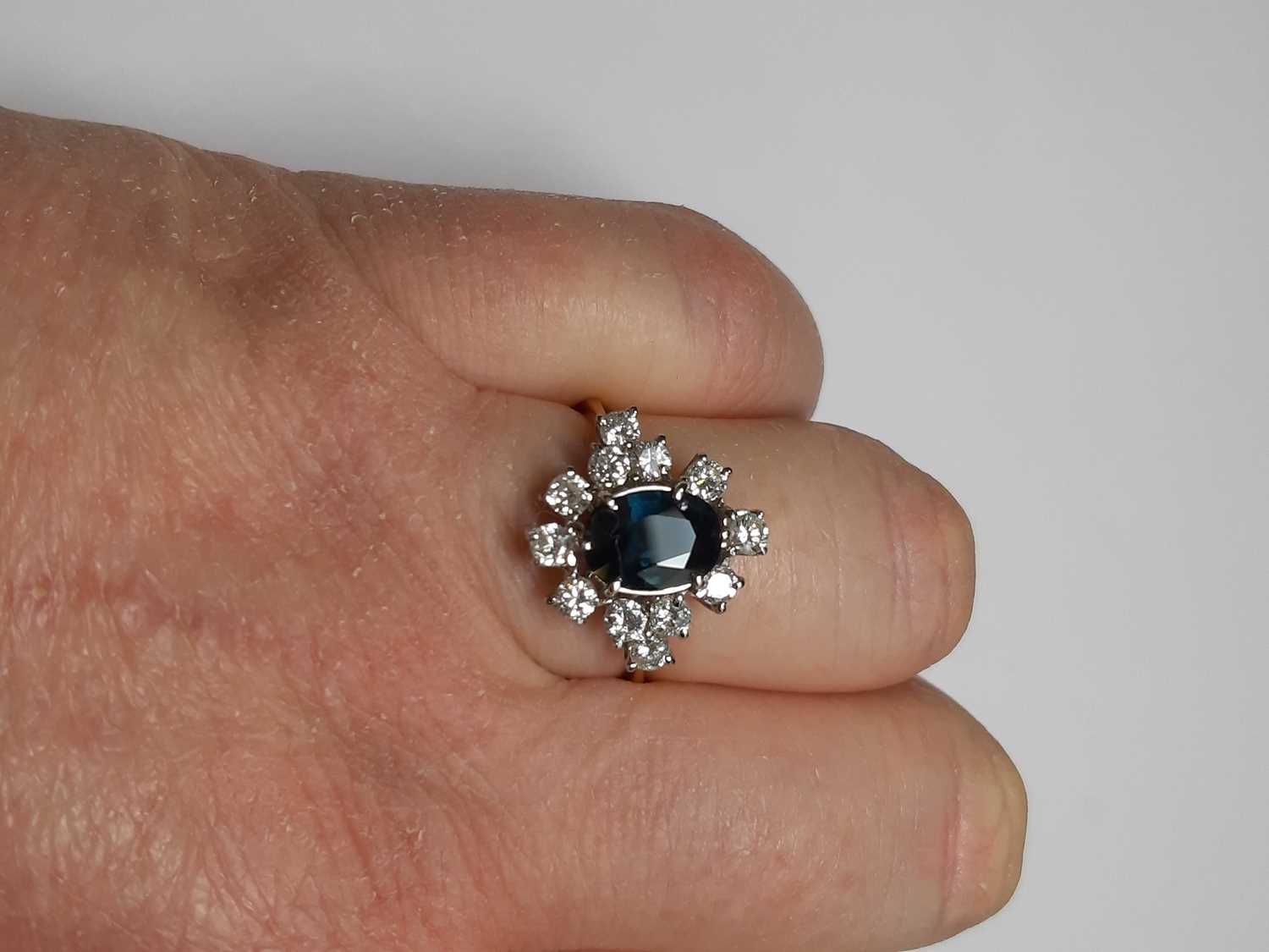 A sapphire and diamond cluster ring. - Image 3 of 7