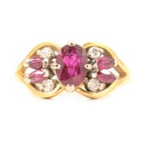 A ruby and diamond cluster ring.