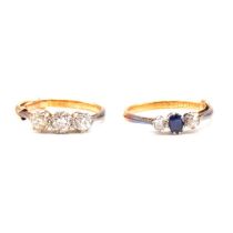 A diamond three stone ring and a sapphire and diamond three stone ring.