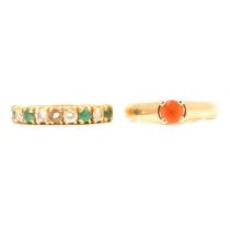An emerald and diamond half hoop ring and a fire opal solitaire ring.
