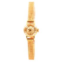 Longines - a lady's 18 carat yellow gold bracelet watch.