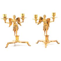 Pair of brass table candlesticks, modelled with fairies,