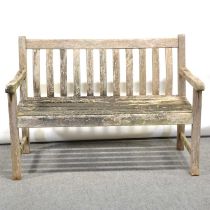 Teak garden bench and two chairs,