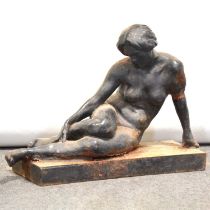 Cast iron garden sculpture of a resting nude