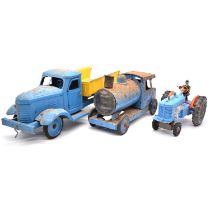 Marx toy tractor; metal tipping truck; metal locomotive.