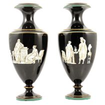 Two Grecian style black vases