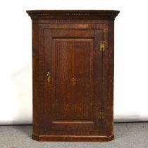 Two Georgian oak cupboards and a mahogany hanging corner cabinet