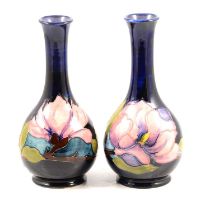 Moorcroft Pottery, a pair of 'Magnolia' design vases