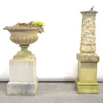 Cast concrete urn and a sundial,