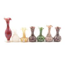 Five millefiori jugs/vases, two other glass Murano style vases.