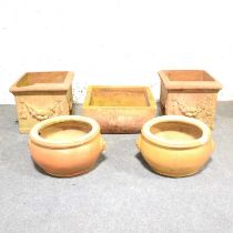 Two pairs of terracotta planters and one other,