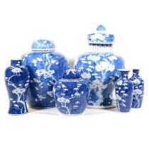 Three Chinese blue and white prunus jars and three vases,
