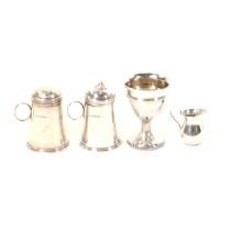 George III silver egg cup, dredger type salt and pepper and a miniature jug,