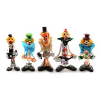 A collection of twelve Murano clowns