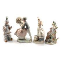 Four Lladro figural groups, and two other similar