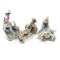 Three large Lladro figurines.