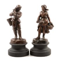 L Goyeau, a pair of French patinated art metal figures of a Breton fisherboy and girl