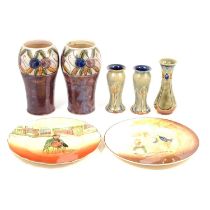 Two pairs of Doulton glazed stoneware vases and a single vase, two series ware plates.