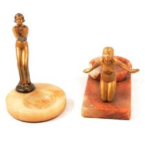 Two Art Deco onyx ashtrays mounted with spelter ladies,