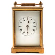 French brass carriage clock, enamelled dial, movement striking on a gong, 15cm.