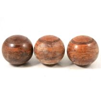 A collection of wooden lawn bowls/ woods,