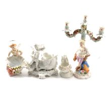 Continental porcelain candelabra, and three other cherub pieces