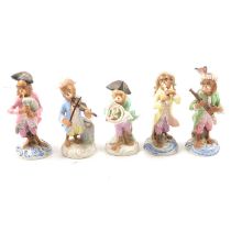 Collection of five German porcelain Monkey Band figures.