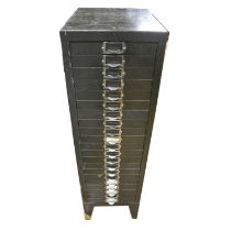 A cabinet containing quantity of steel and brass