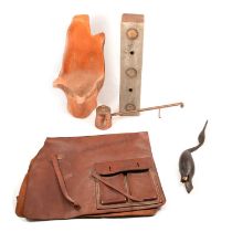 A vintage jockey's leather race day weight cloth with weights, etc