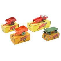 Four Dinky Toys die-cast models including 312 Massey-Harris manure spreader