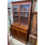 A late Victorian mahogany bookcase cupboard, width 108cm, depth 52cm, height 215cm