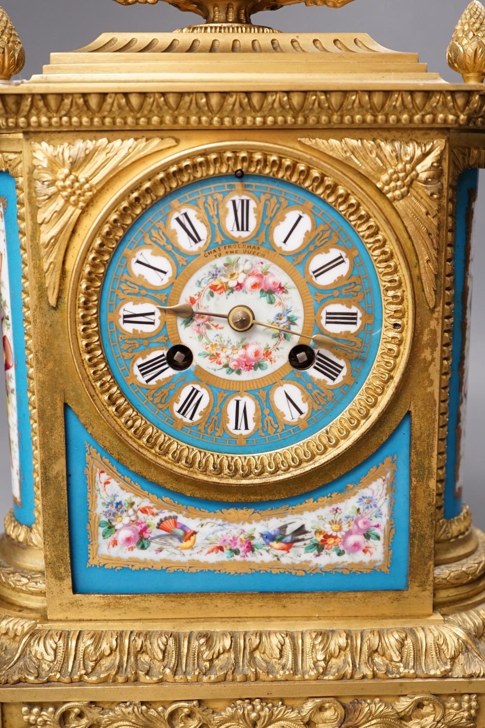 A French ormolu mantel clock, with inset floral decorated porcelain plaques and dial, 40cms high - Image 2 of 7