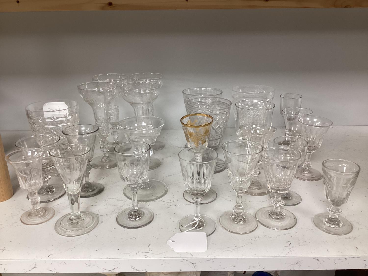 A quantity of assorted 18th / 19th century and later clear drinking glasses including a damaged