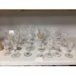 A quantity of assorted 18th / 19th century and later clear drinking glasses including a damaged