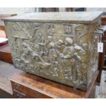 A Dutch style brass repousse log box, width 79cms, depth 35cms, height 57cms.