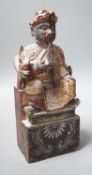 A 19th century Chinese painted wood figure with ink inscription verso, 24.5cms high
