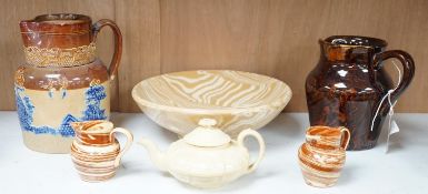 A Victorian solid agate ware pottery jug, a similar bowl and pair of miniature jugs, an unusual
