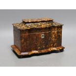 A 19th century tortoiseshell veneered tea caddy, ivory veneered edging, 20cms wide Ivory