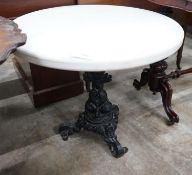 A Victorian style circular cast iron and reconstituted marble top occasional table, diameter 75cm,